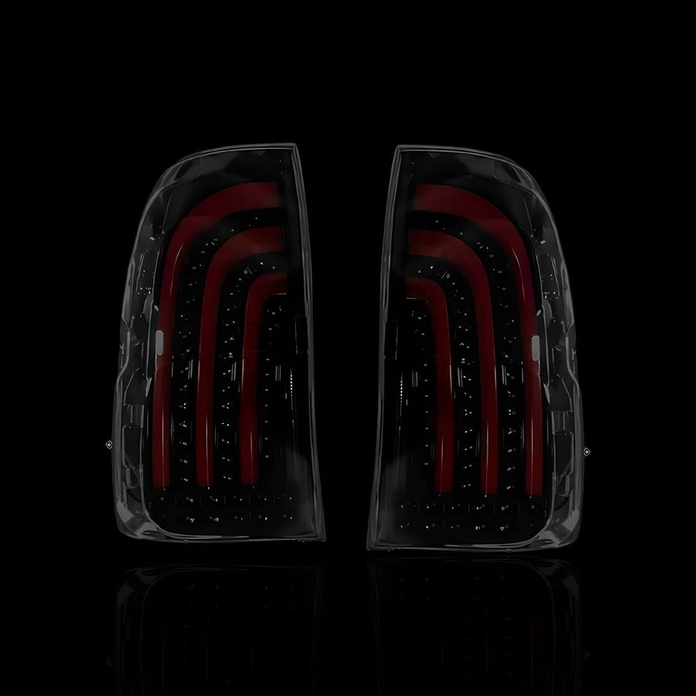 
                  
                    Sequential Smoked 3D Stripe Bar Full LED Tail Lights – Fits Toyota Hilux N80 / Revo Rocco (2015–2024) | LH + RH Pair - Blckline Automotive
                  
                