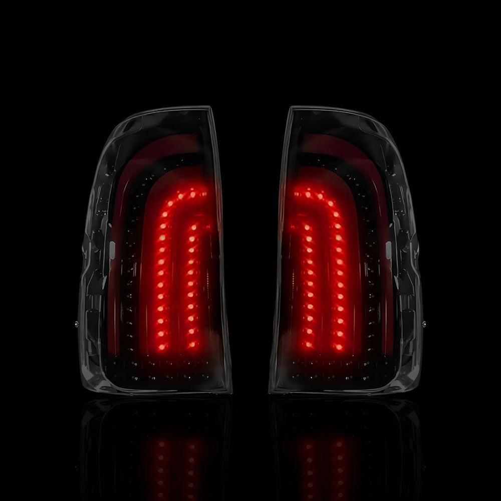 
                  
                    Sequential Smoked 3D Stripe Bar Full LED Tail Lights – Fits Toyota Hilux N80 / Revo Rocco (2015–2024) | LH + RH Pair - Blckline Automotive
                  
                