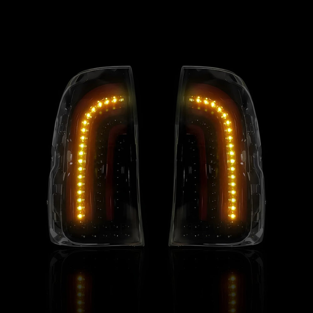 
                  
                    Sequential Smoked 3D Stripe Bar Full LED Tail Lights – Fits Toyota Hilux N80 / Revo Rocco (2015–2024) | LH + RH Pair - Blckline Automotive
                  
                