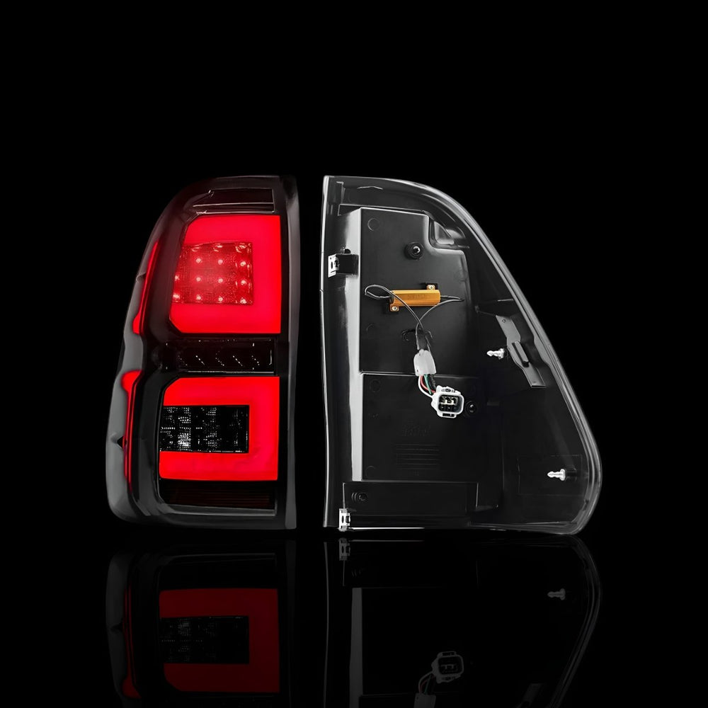 
                  
                    Sequential Smoked C - Style LED Tail Lights – Fits Toyota Hilux N80 (2015–2024) | LH + RH Pair - Blckline Automotive
                  
                