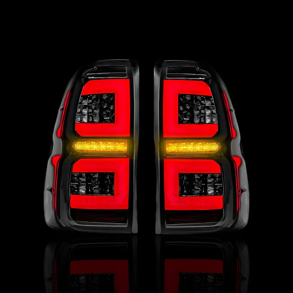
                  
                    Sequential Smoked C - Style LED Tail Lights – Fits Toyota Hilux N80 (2015–2024) | LH + RH Pair - Blckline Automotive
                  
                