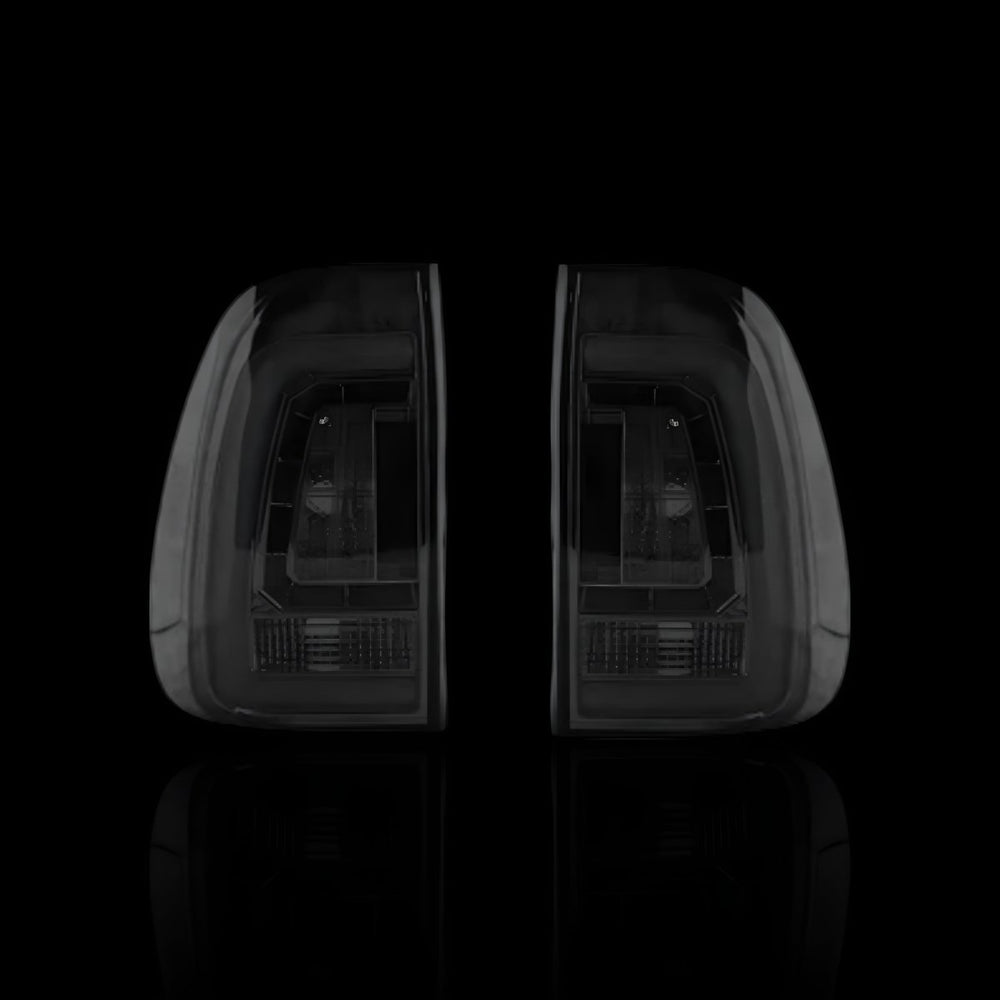 
                  
                    Smoked Black 3D Stripe Bar LED Tail Lights – Fits Toyota Hilux N80 / Revo Rocco (2015–2024) | LH + RH Pair - Blckline Automotive
                  
                