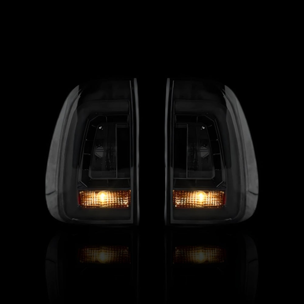 
                  
                    Smoked Black 3D Stripe Bar LED Tail Lights – Fits Toyota Hilux N80 / Revo Rocco (2015–2024) | LH + RH Pair - Blckline Automotive
                  
                