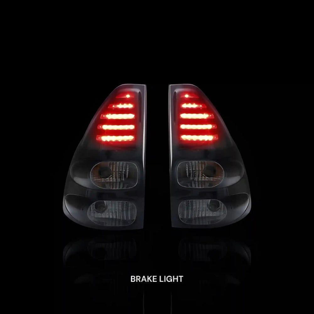 
                  
                    Smoked Black LED Tail Lights – Fits Toyota Prado 120 Series (2003–2009) | LH + RH Pair - Blckline Automotive
                  
                