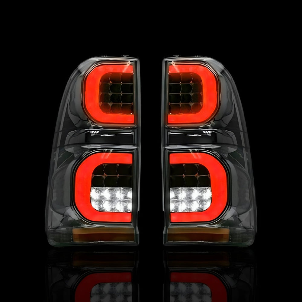 
                  
                    Smoked Tail Lights – Fits Toyota Hilux N70 (2005–2015) | LH + RH Pair - Blckline Automotive
                  
                